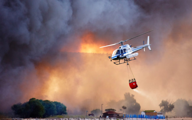 Helicopter in bush fire in Sardinia