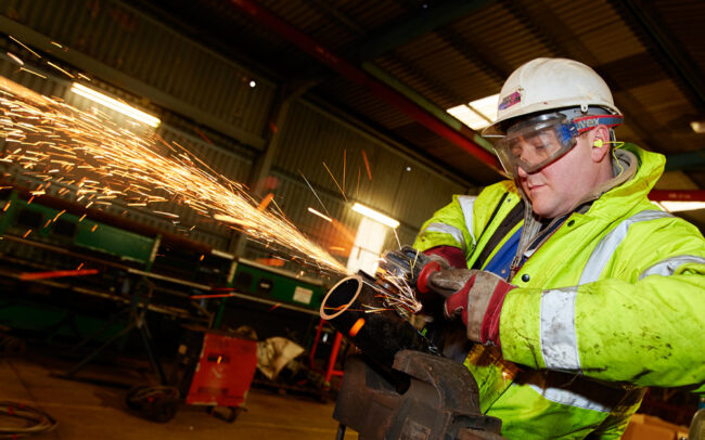 Man working in Hebridean Princess maintenance yard