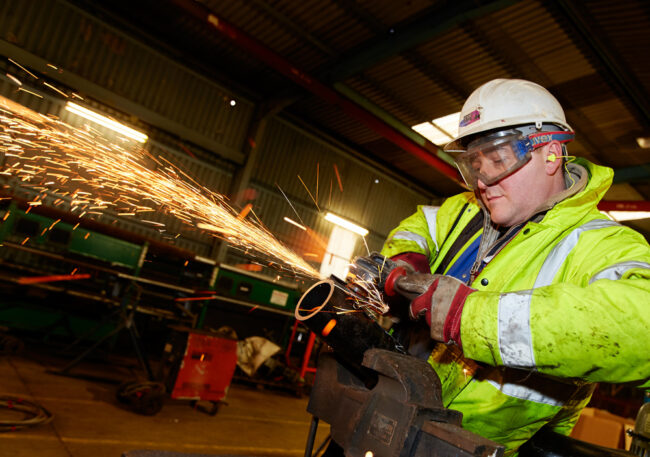 Man working in Hebridean Princess maintenance yard